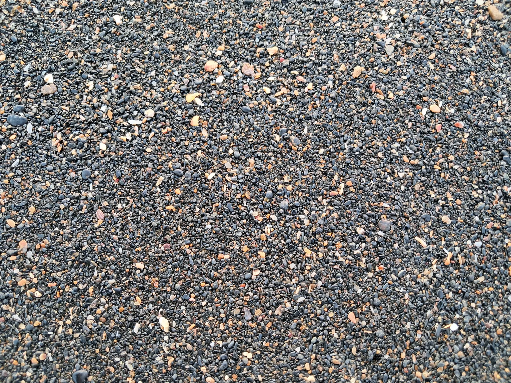 The dark, fine sand at Tilmati