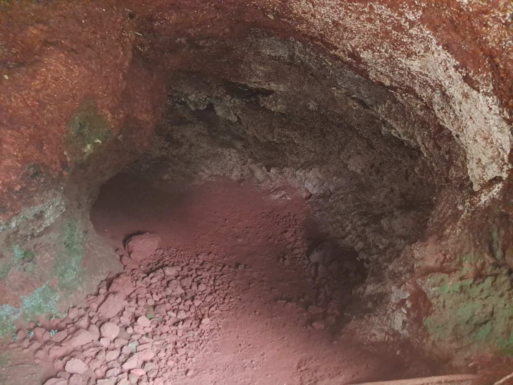 Inside, the red laterite floor