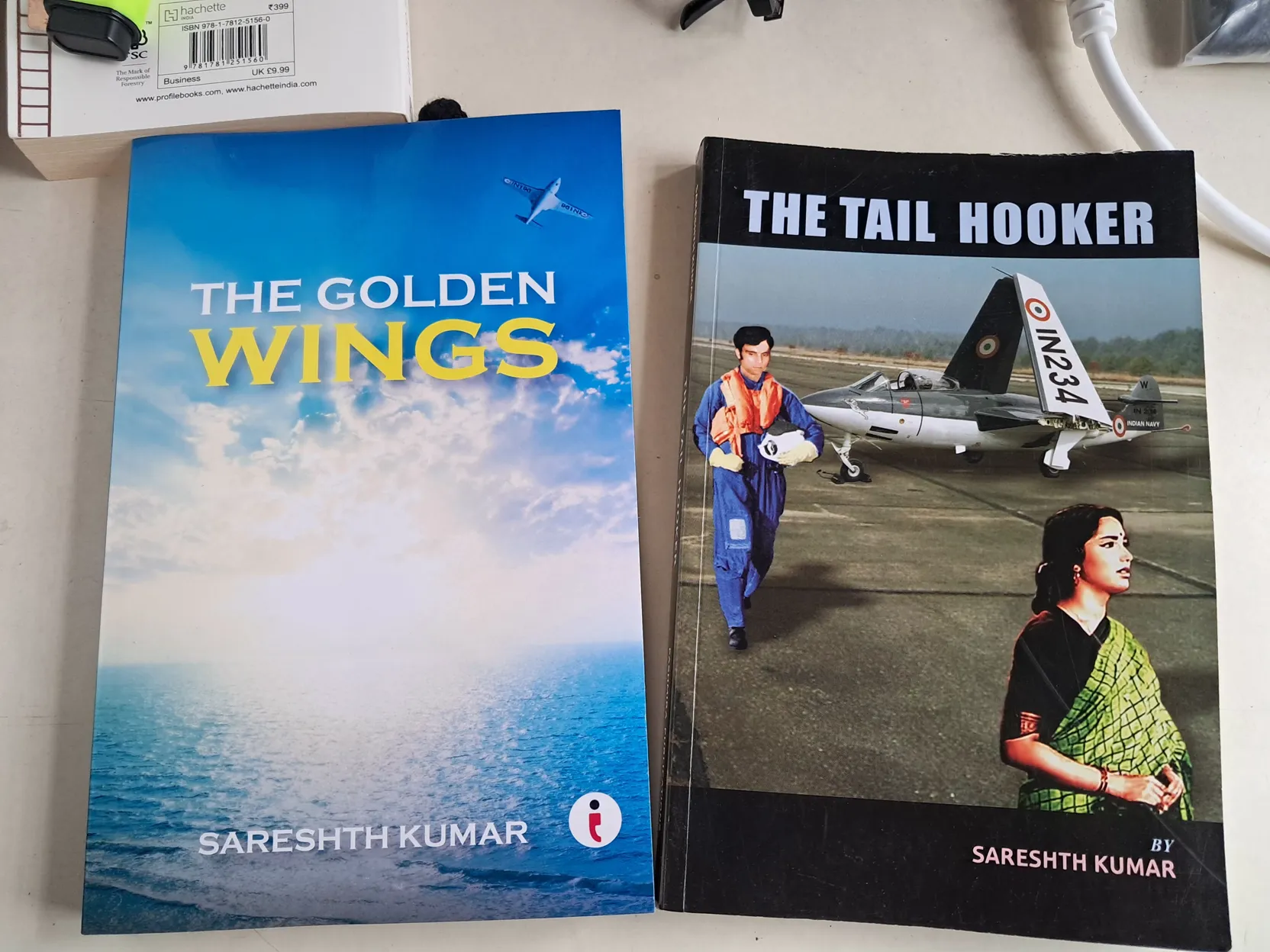 Two books from the museum shop, The Golden Wings and The Tail Hooker by Sareshth Kumar